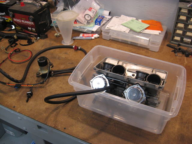 Leak testing carb assembly.